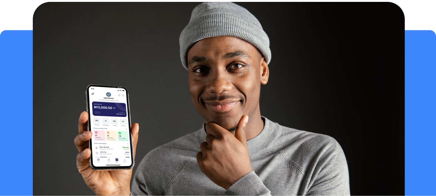 A lady holding a phone with assets mobile app